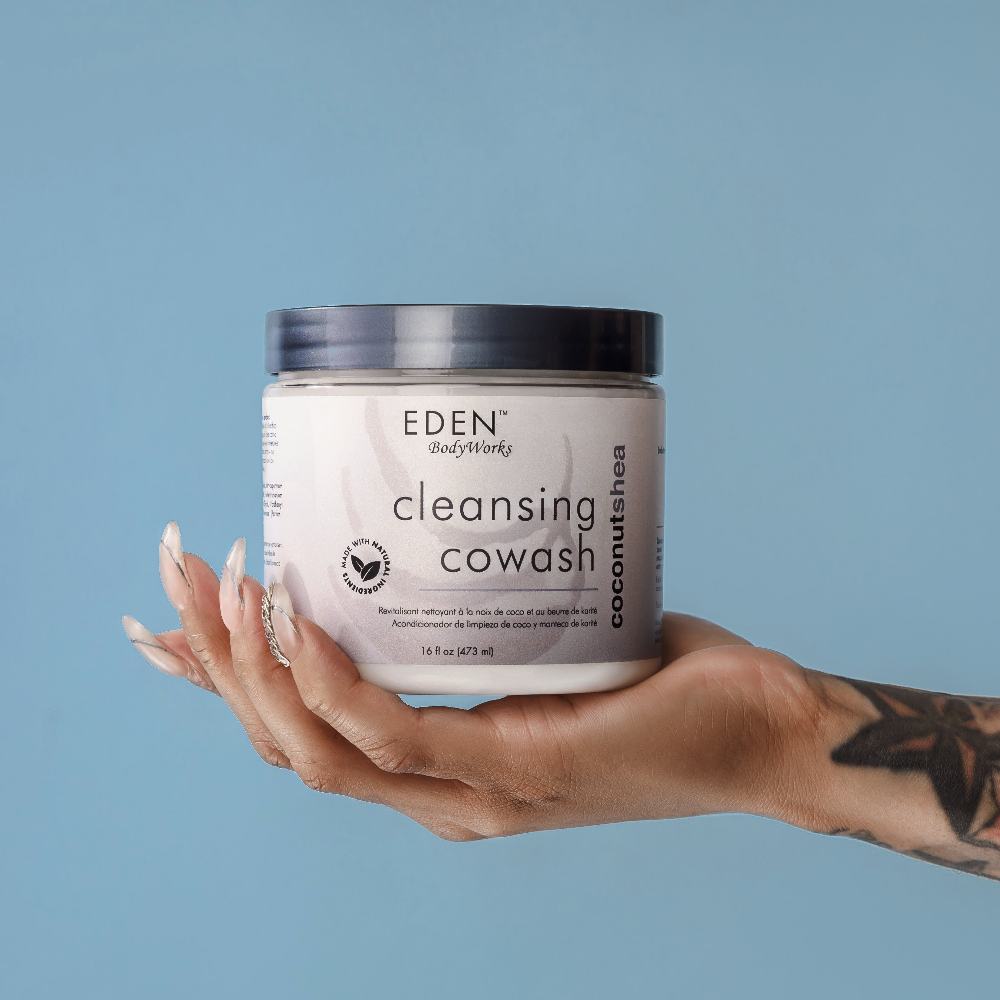Hand holding EDEN BodyWorks Cleansing Cowash